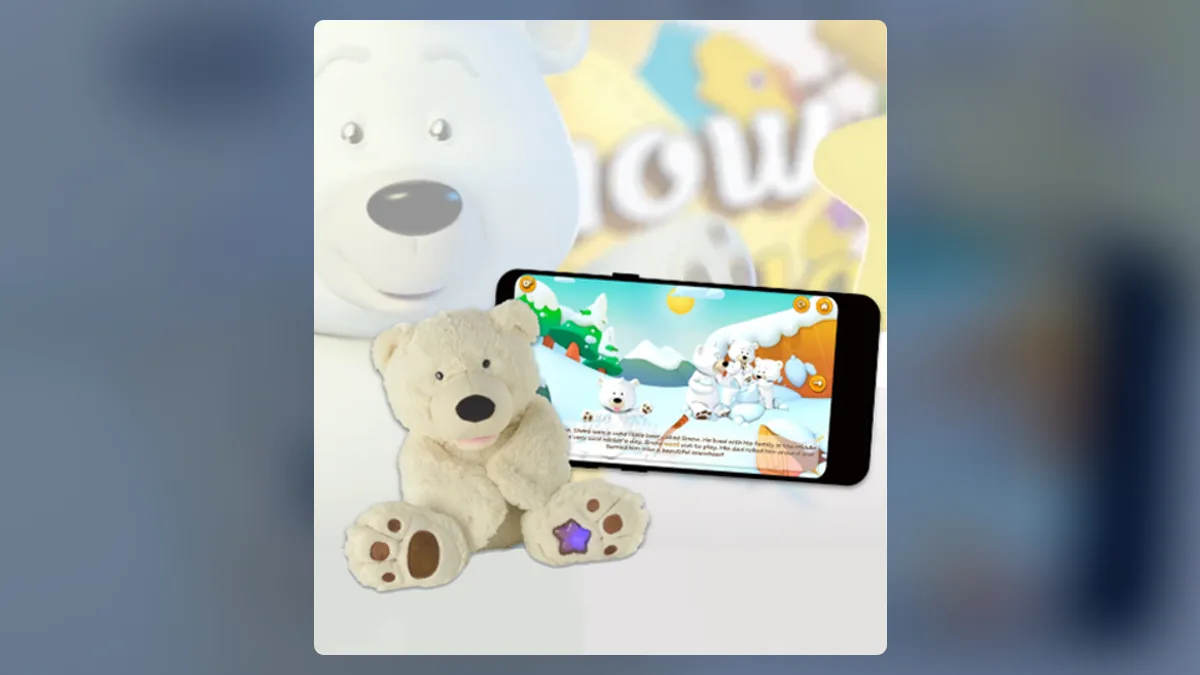 Snow and Stella product shot: a white polar bear plush toy beside a phone running the companion app.